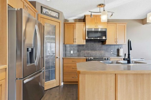 202 New Brighton Manor Se, Calgary, AB - Indoor Photo Showing Kitchen With Double Sink With Upgraded Kitchen