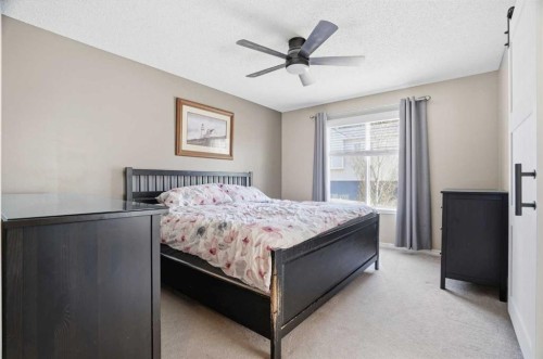 202 New Brighton Manor Se, Calgary, AB - Indoor Photo Showing Bedroom