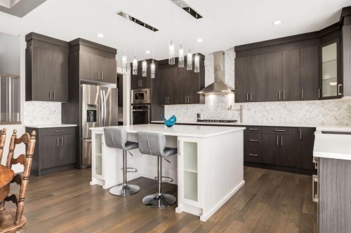 109 Kinniburgh Bay, Chestermere, AB - Indoor Photo Showing Kitchen With Stainless Steel Kitchen With Upgraded Kitchen