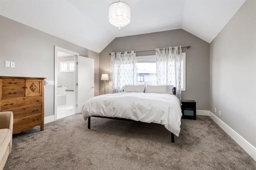 109 Kinniburgh Bay, Chestermere, AB - Indoor Photo Showing Bedroom