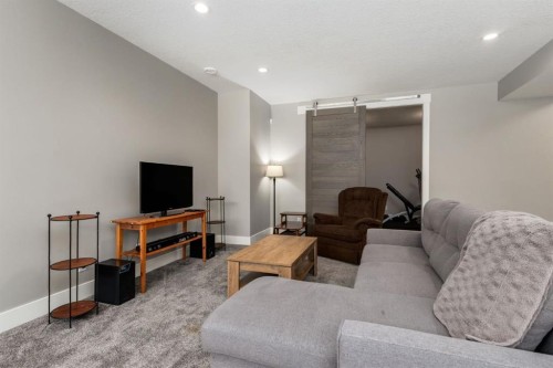 109 Kinniburgh Bay, Chestermere, AB - Indoor Photo Showing Living Room