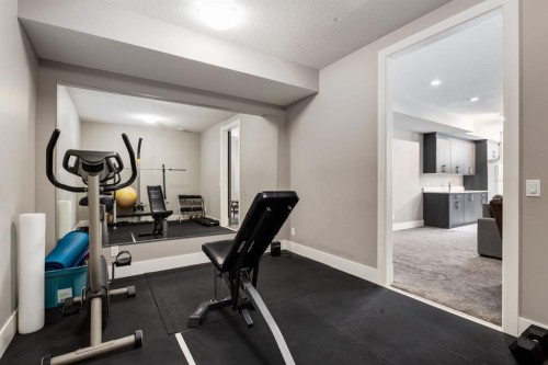 109 Kinniburgh Bay, Chestermere, AB - Indoor Photo Showing Gym Room