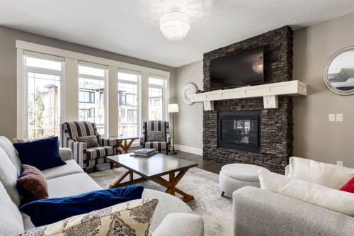 109 Kinniburgh Bay, Chestermere, AB - Indoor Photo Showing Living Room With Fireplace