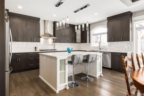 109 Kinniburgh Bay, Chestermere, AB - Indoor Photo Showing Kitchen With Stainless Steel Kitchen With Upgraded Kitchen