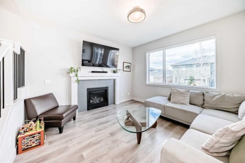 81 Willow Court, Cochrane, AB - Indoor Photo Showing Living Room With Fireplace