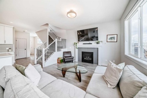 81 Willow Court, Cochrane, AB - Indoor Photo Showing Living Room With Fireplace