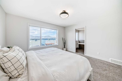 81 Willow Court, Cochrane, AB - Indoor Photo Showing Bedroom