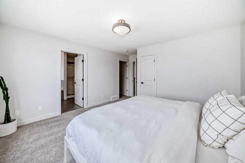 81 Willow Court, Cochrane, AB - Indoor Photo Showing Bedroom