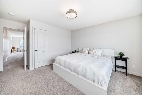 81 Willow Court, Cochrane, AB - Indoor Photo Showing Bedroom