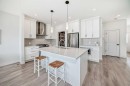 81 Willow Court, Cochrane, AB  - Indoor Photo Showing Kitchen With Double Sink With Upgraded Kitchen 