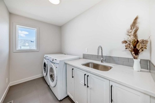 81 Willow Court, Cochrane, AB - Indoor Photo Showing Laundry Room