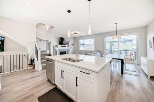 81 Willow Court, Cochrane, AB - Indoor Photo Showing Kitchen With Double Sink With Upgraded Kitchen