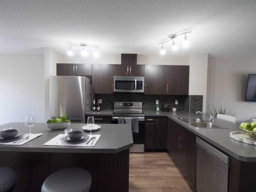 304 Chaparral Valley Square Se, Calgary, AB - Indoor Photo Showing Kitchen With Stainless Steel Kitchen With Double Sink
