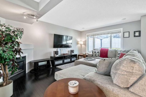 113 Harvest Oak Rise Ne, Calgary, AB - Indoor Photo Showing Living Room With Fireplace