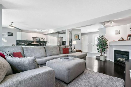 113 Harvest Oak Rise Ne, Calgary, AB - Indoor Photo Showing Living Room With Fireplace