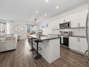 414 Windrow Common Sw, Airdrie, AB  - Indoor Photo Showing Kitchen With Stainless Steel Kitchen With Upgraded Kitchen 