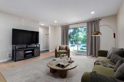 840 Raynard Crescent Se, Calgary, AB - Indoor Photo Showing Living Room