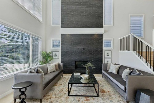 7865 8A Avenue Sw, Calgary, AB - Indoor Photo Showing Living Room With Fireplace