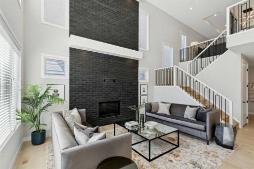 7865 8A Avenue Sw, Calgary, AB - Indoor Photo Showing Living Room With Fireplace