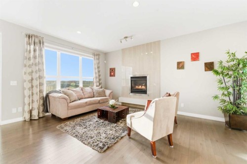 71 Evansfield Rise Nw, Calgary, AB - Indoor Photo Showing Living Room With Fireplace