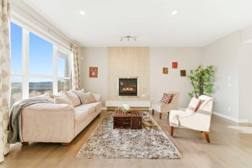 71 Evansfield Rise Nw, Calgary, AB - Indoor Photo Showing Living Room With Fireplace