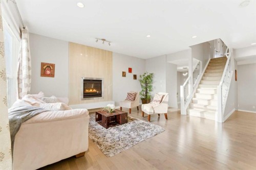 71 Evansfield Rise Nw, Calgary, AB - Indoor Photo Showing Living Room With Fireplace