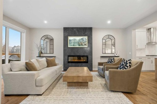 135 Silver Spruce Grove Sw, Calgary, AB - Indoor Photo Showing Living Room With Fireplace