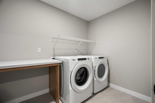 135 Silver Spruce Grove Sw, Calgary, AB - Indoor Photo Showing Laundry Room