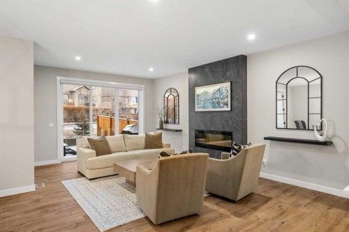 135 Silver Spruce Grove Sw, Calgary, AB - Indoor Photo Showing Living Room With Fireplace