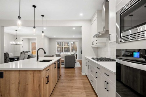 135 Silver Spruce Grove Sw, Calgary, AB - Indoor Photo Showing Kitchen With Upgraded Kitchen