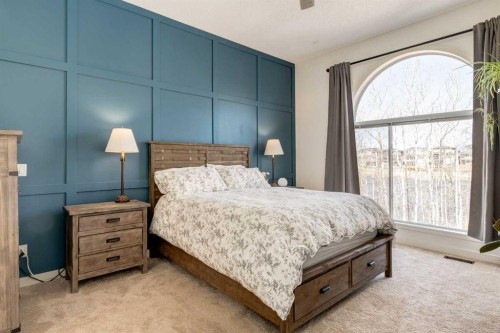 402 Rocky Ridge Cove Nw, Calgary, AB - Indoor Photo Showing Bedroom