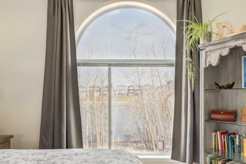 402 Rocky Ridge Cove Nw, Calgary, AB - Indoor Photo Showing Bedroom