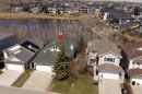 402 Rocky Ridge Cove Nw, Calgary, AB  - Outdoor With Body Of Water 