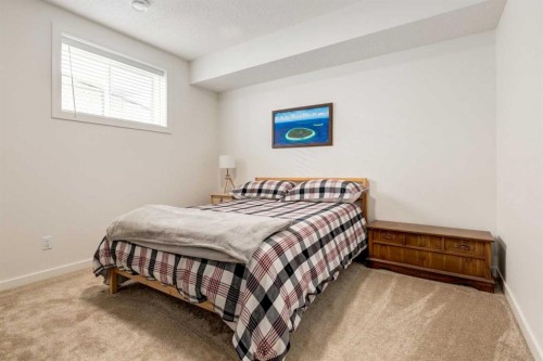 402 Rocky Ridge Cove Nw, Calgary, AB - Indoor Photo Showing Bedroom