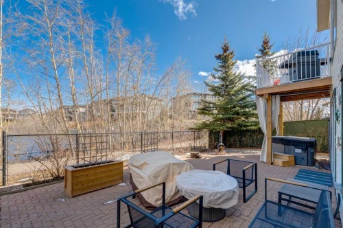 402 Rocky Ridge Cove Nw, Calgary, AB - Outdoor With Deck Patio Veranda
