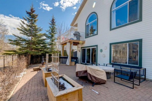 402 Rocky Ridge Cove Nw, Calgary, AB - Outdoor With Deck Patio Veranda With Exterior