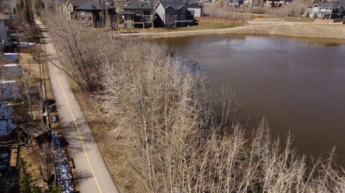 402 Rocky Ridge Cove Nw, Calgary, AB - Outdoor With Body Of Water With View