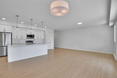 1102-33 Carringham Gate Nw, Calgary, AB - Indoor Photo Showing Kitchen With Stainless Steel Kitchen With Upgraded Kitchen