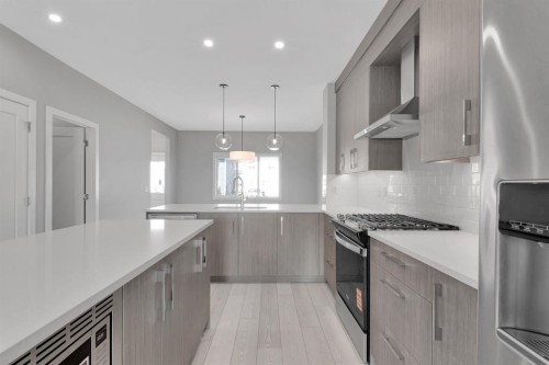 157 Dawson Wharf View, Chestermere, AB - Indoor Photo Showing Kitchen With Stainless Steel Kitchen With Upgraded Kitchen