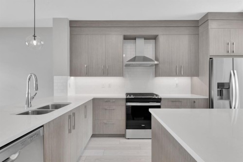 157 Dawson Wharf View, Chestermere, AB - Indoor Photo Showing Kitchen With Stainless Steel Kitchen With Double Sink With Upgraded Kitchen