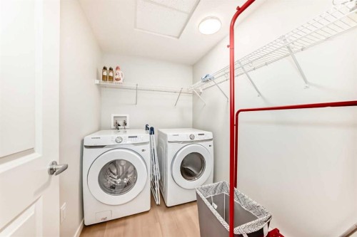 1303-33 Carringham Gate Nw, Calgary, AB - Indoor Photo Showing Laundry Room