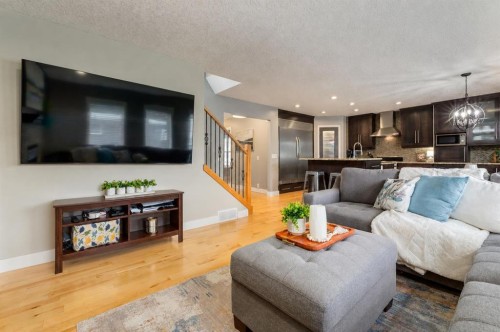 16 Prestwick Road Se, Calgary, AB - Indoor Photo Showing Living Room