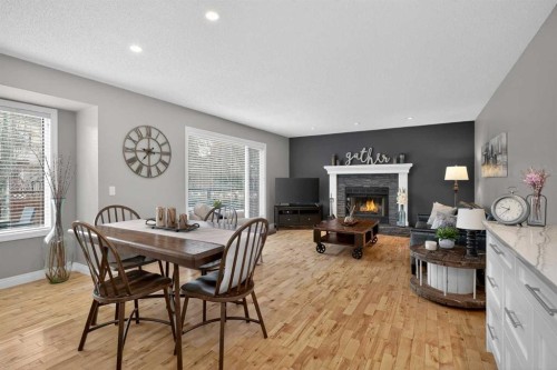3513 Douglas Woods Heights Se, Calgary, AB - Indoor Photo Showing Dining Room With Fireplace