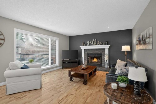 3513 Douglas Woods Heights Se, Calgary, AB - Indoor Photo Showing Living Room With Fireplace