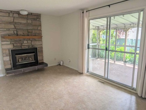3711 Beaver Road Nw, Calgary, AB - Indoor Photo Showing Living Room With Fireplace