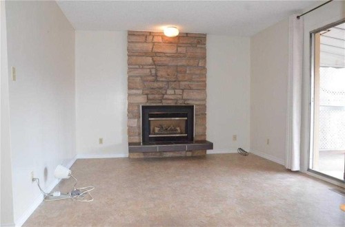 3711 Beaver Road Nw, Calgary, AB - Indoor Photo Showing Living Room With Fireplace