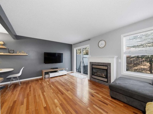 101 Everstone Place Sw, Calgary, AB - Indoor Photo Showing Living Room With Fireplace