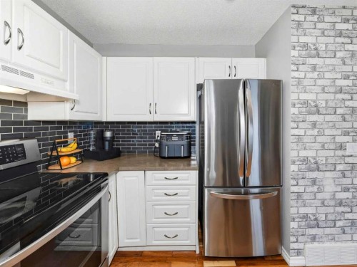 101 Everstone Place Sw, Calgary, AB - Indoor Photo Showing Kitchen With Stainless Steel Kitchen