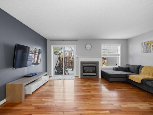 101 Everstone Place Sw, Calgary, AB - Indoor Photo Showing Living Room With Fireplace
