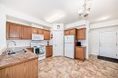 446-15 Everstone Drive Sw, Calgary, AB  - Indoor Photo Showing Kitchen With Double Sink 